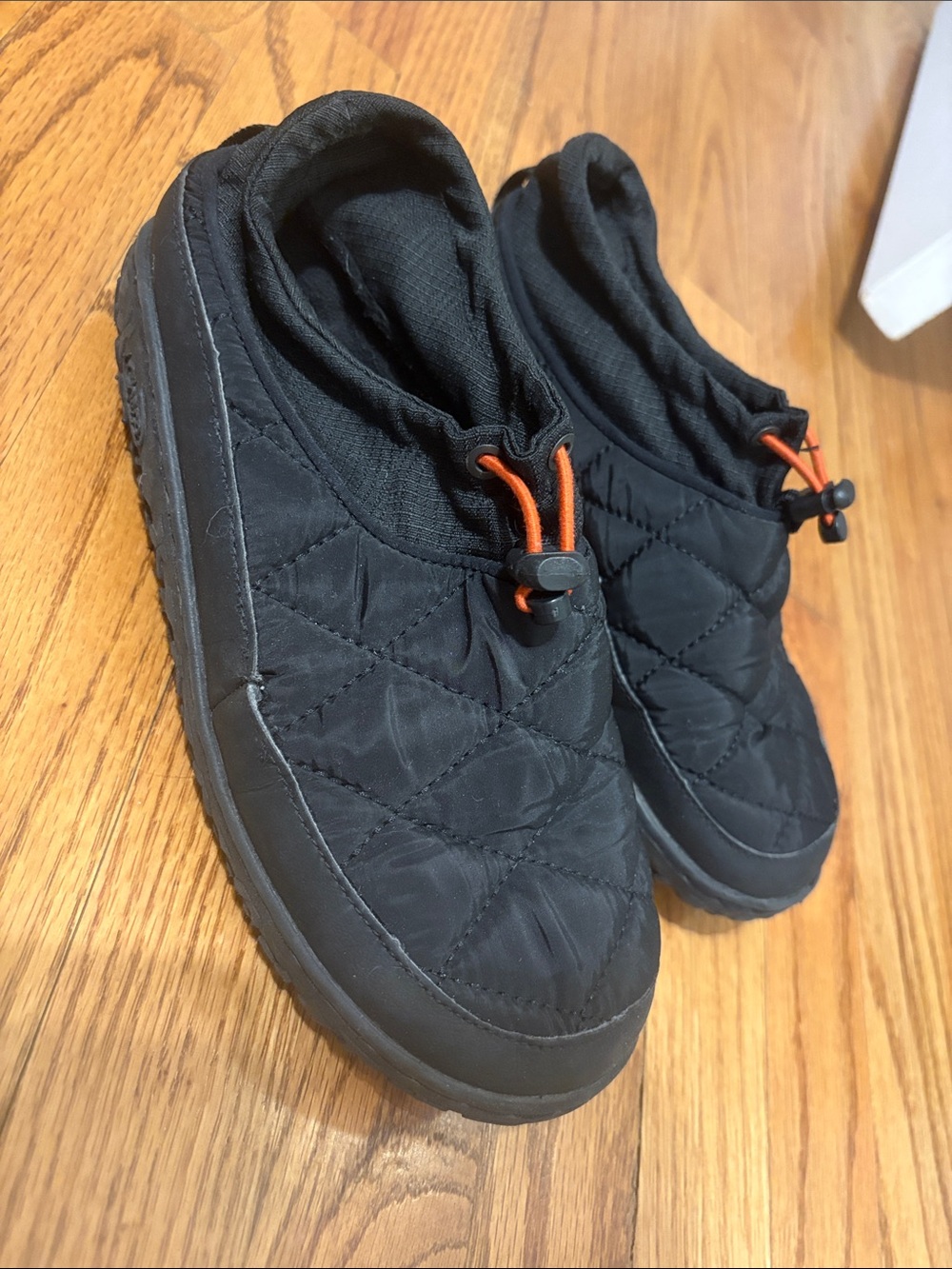 Chaco Ramble Puff Cinch Black Quilted Slip-On Slippers with Orange Toggle